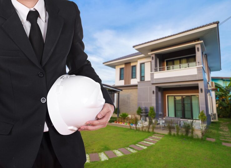 man-holding-umbrella-standing-outside-house_1048944-26119507